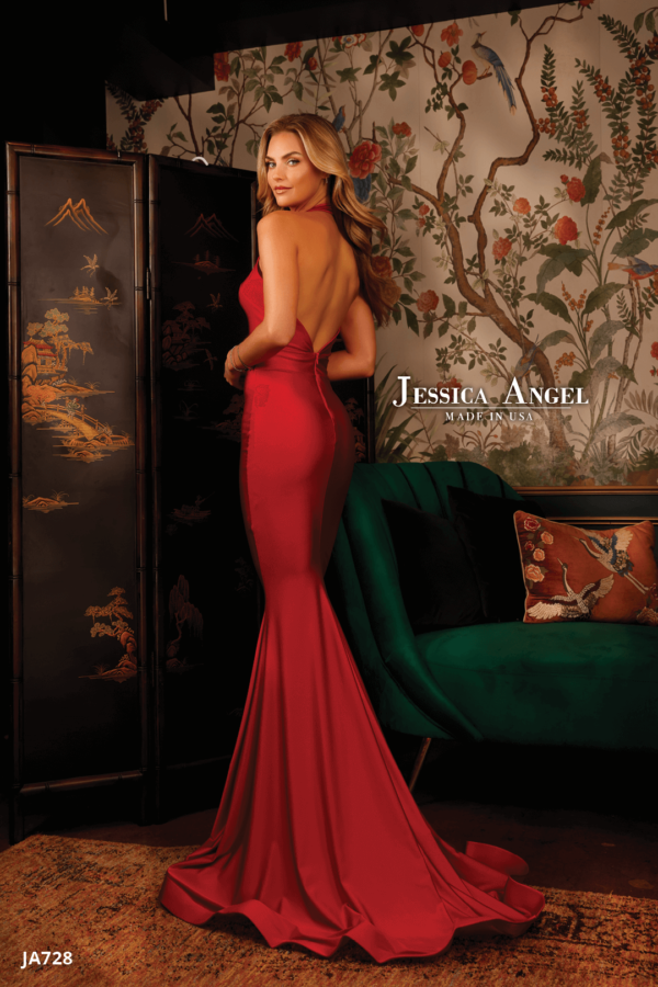 Jessica Angel 728 Halter Gown in red with a plunging V-neckline and mermaid silhouette. Open back with halter neck design.