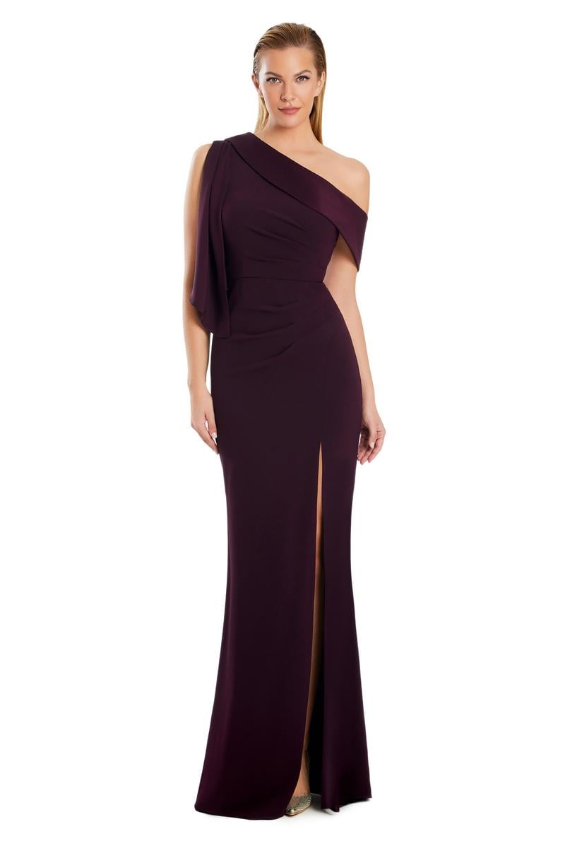 Model wearing Alexander by Daymor 3058S25 one-shoulder draped evening gown with pleated bodice, high side slit, and cascading detail.