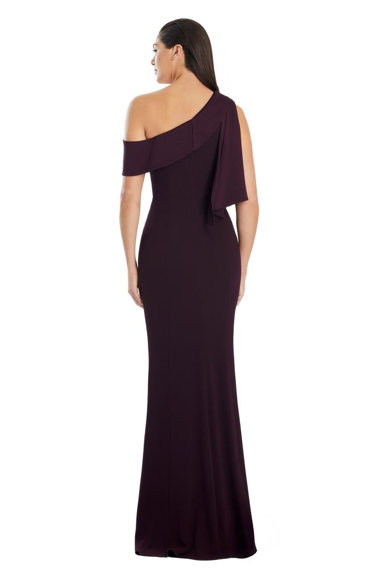 Model wearing Alexander by Daymor 3058S25 one-shoulder draped evening gown with pleated bodice, high side slit, and cascading detail.