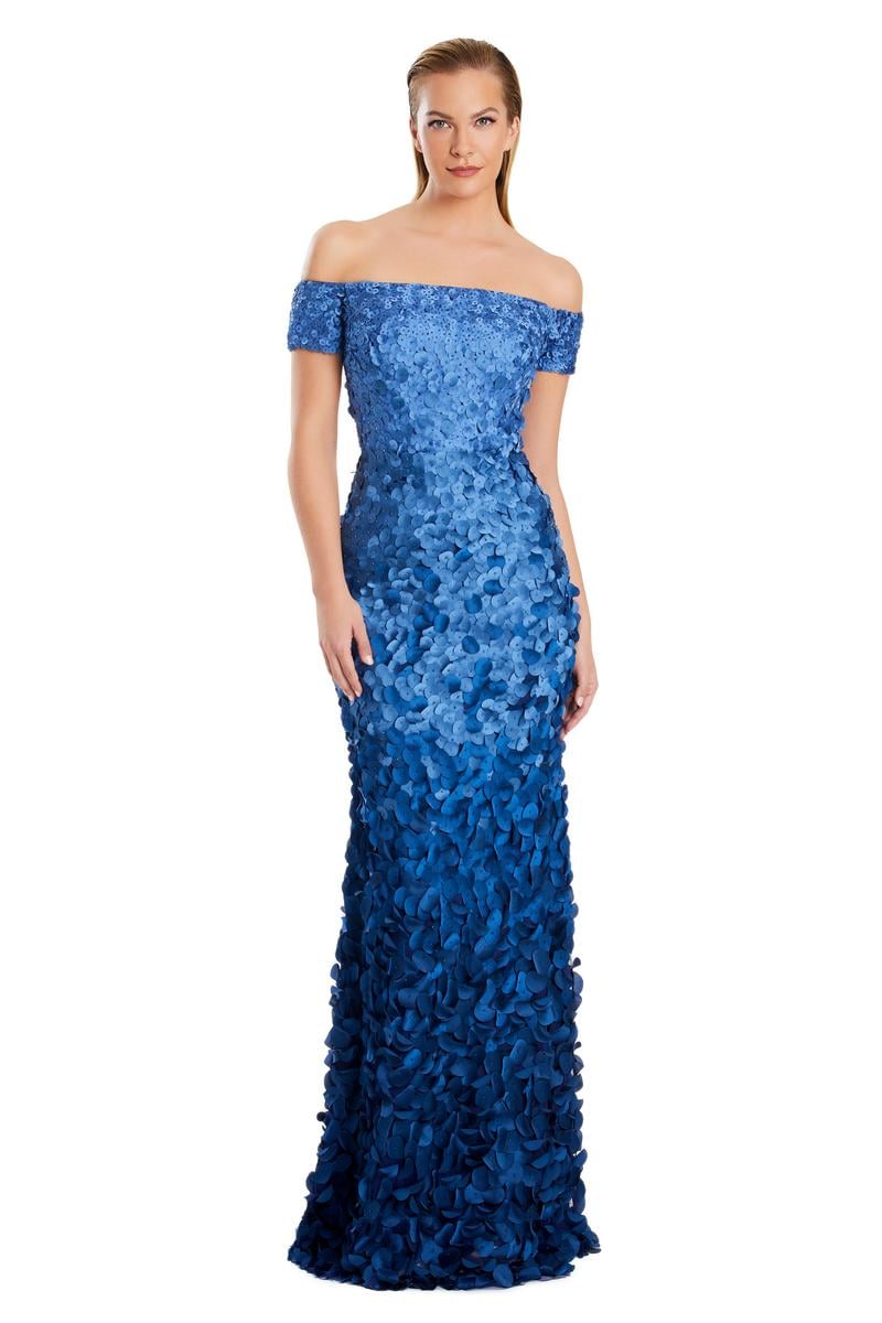 Model wearing Alexander by Daymor 3063S25 off-the-shoulder gown with floral appliqué detailing, fitted silhouette, and floor-length skirt.