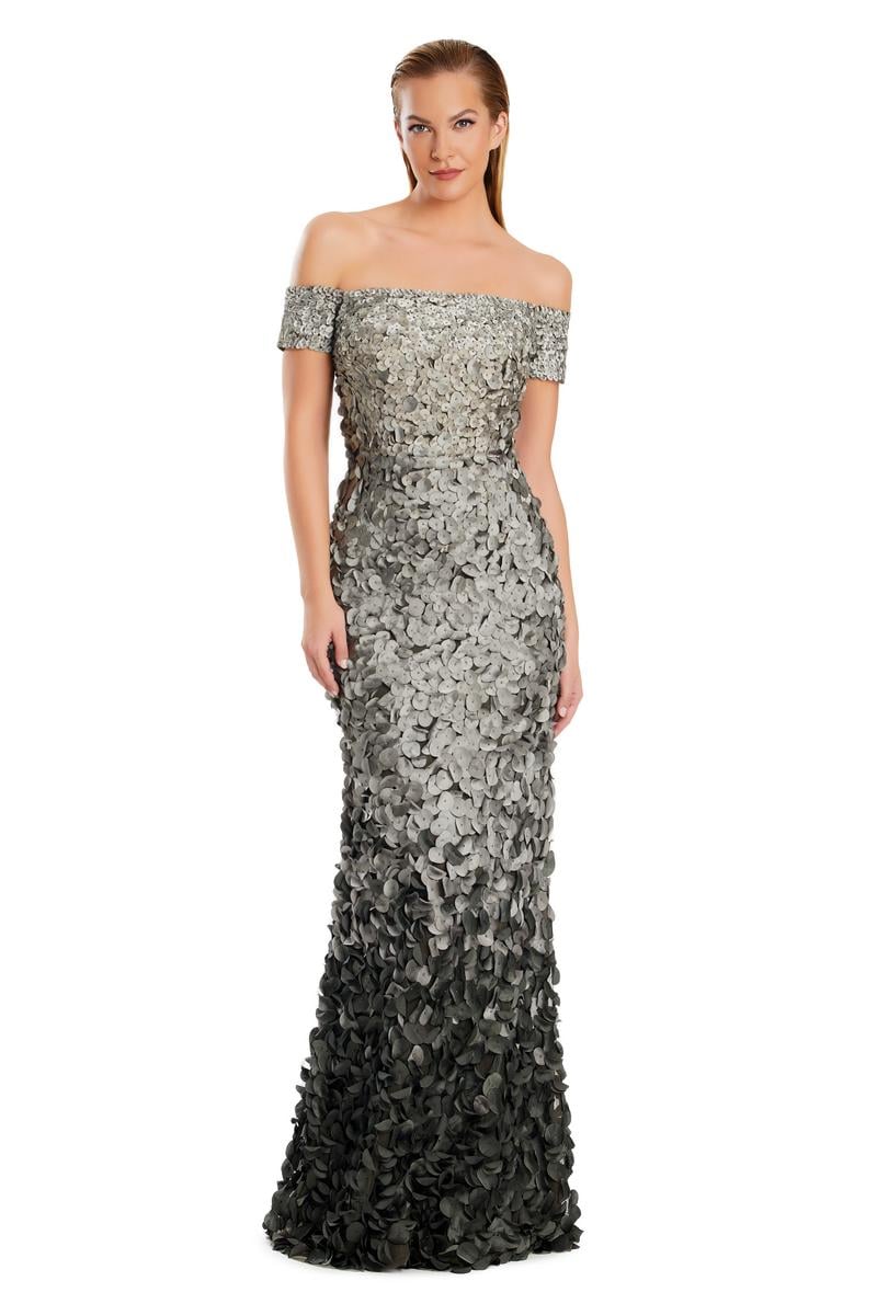 Model wearing Alexander by Daymor 3063S25 off-the-shoulder gown with floral appliqué detailing, fitted silhouette, and floor-length skirt.