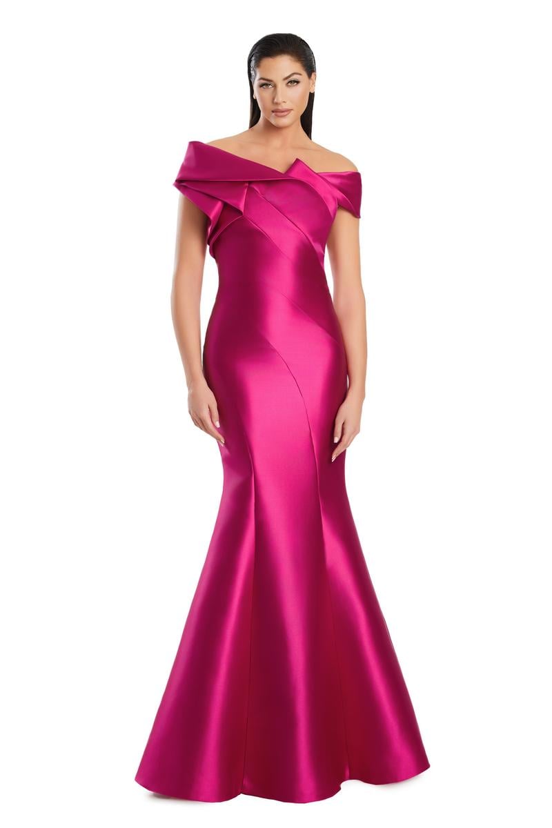 Model wearing Alexander By Daymor 3079CS25 evening gown featuring an off-the-shoulder pleated neckline and flared hemline.