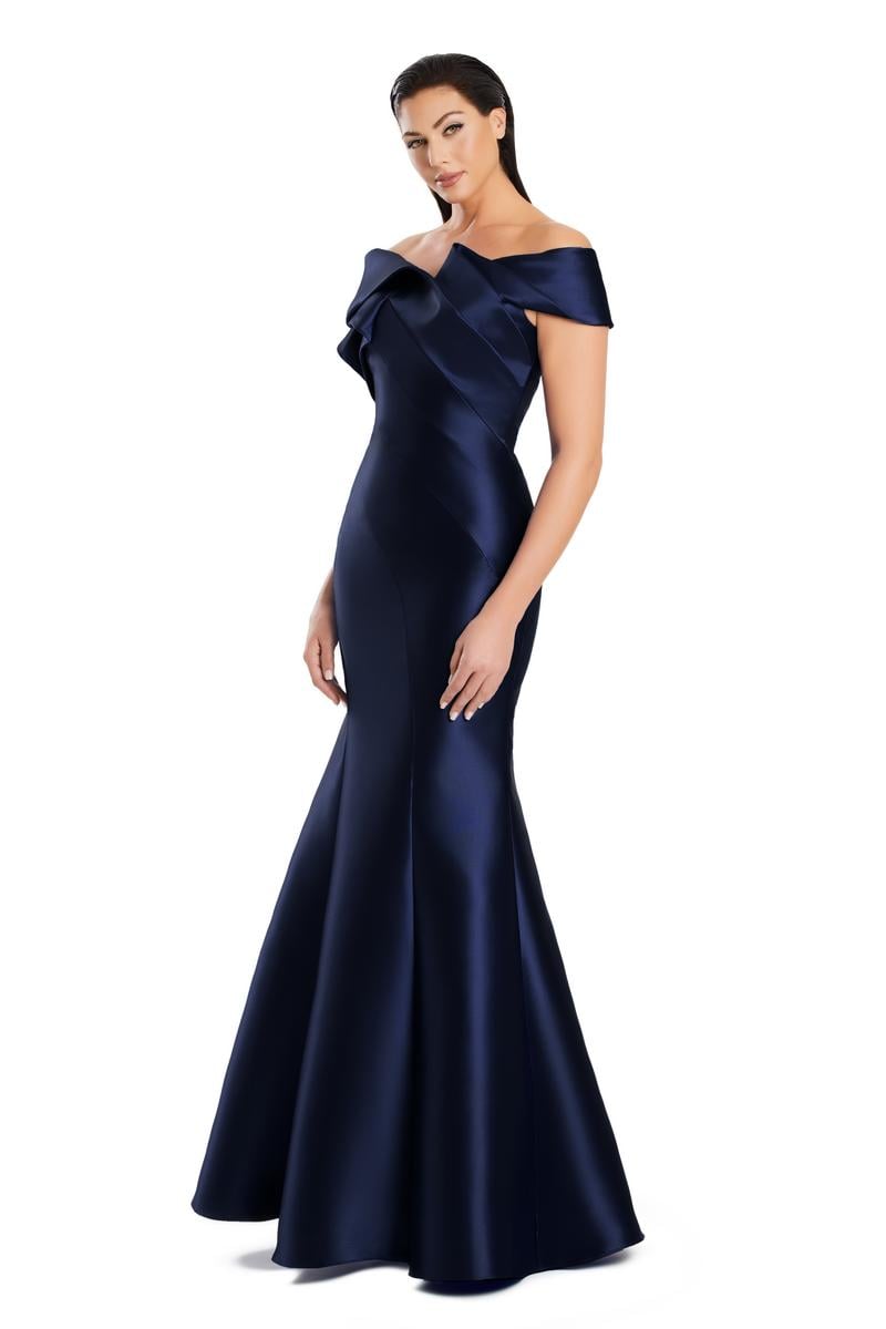 Model wearing Alexander By Daymor 3079CS25 evening gown featuring an off-the-shoulder pleated neckline and flared hemline.