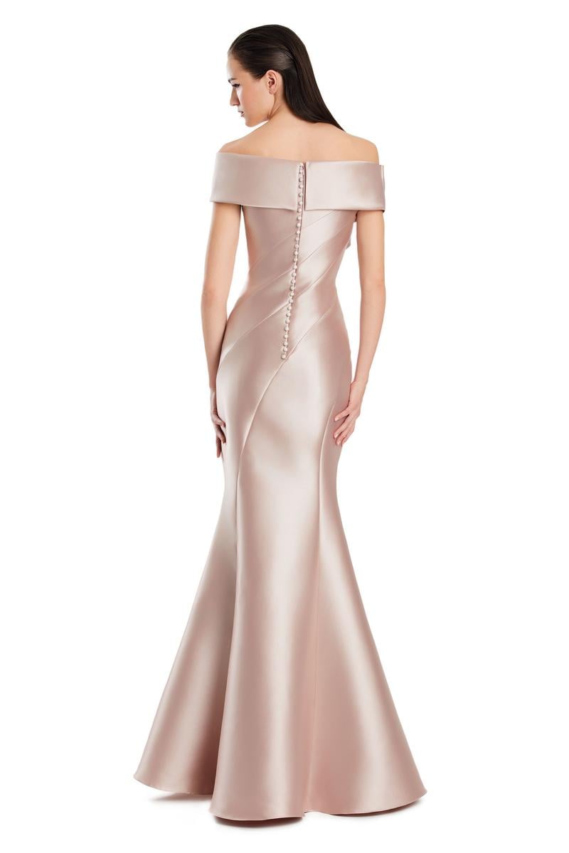 Model wearing Alexander By Daymor 3079CS25 evening gown featuring an off-the-shoulder pleated neckline and flared hemline.