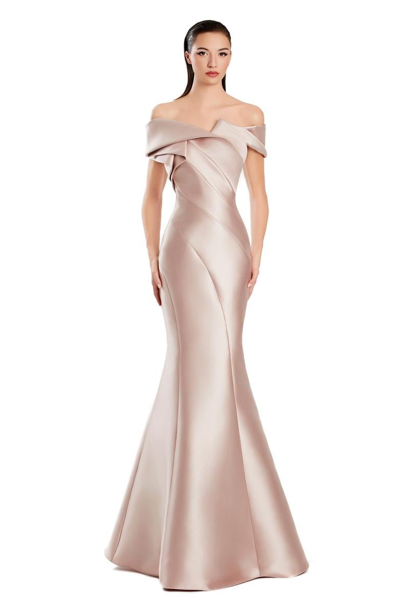 Model wearing Alexander By Daymor 3079CS25 evening gown featuring an off-the-shoulder pleated neckline and flared hemline.