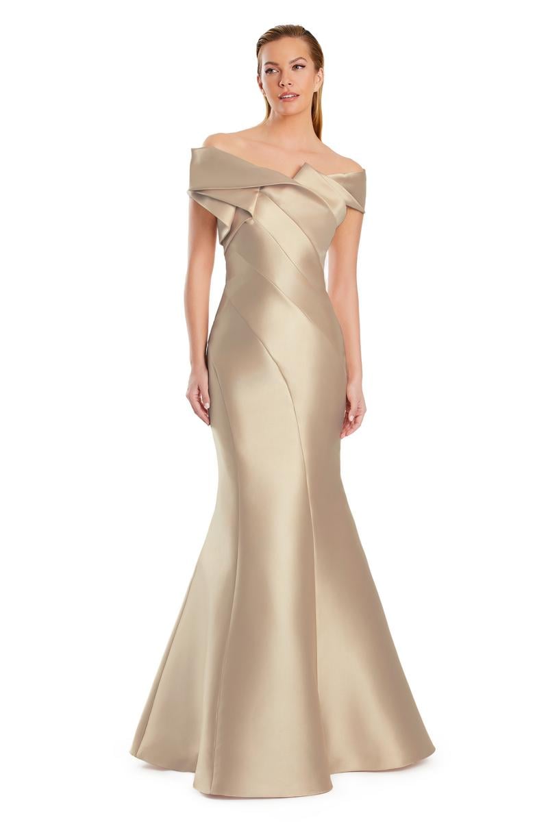 Model wearing Alexander By Daymor 3079CS25 evening gown featuring an off-the-shoulder pleated neckline and flared hemline.