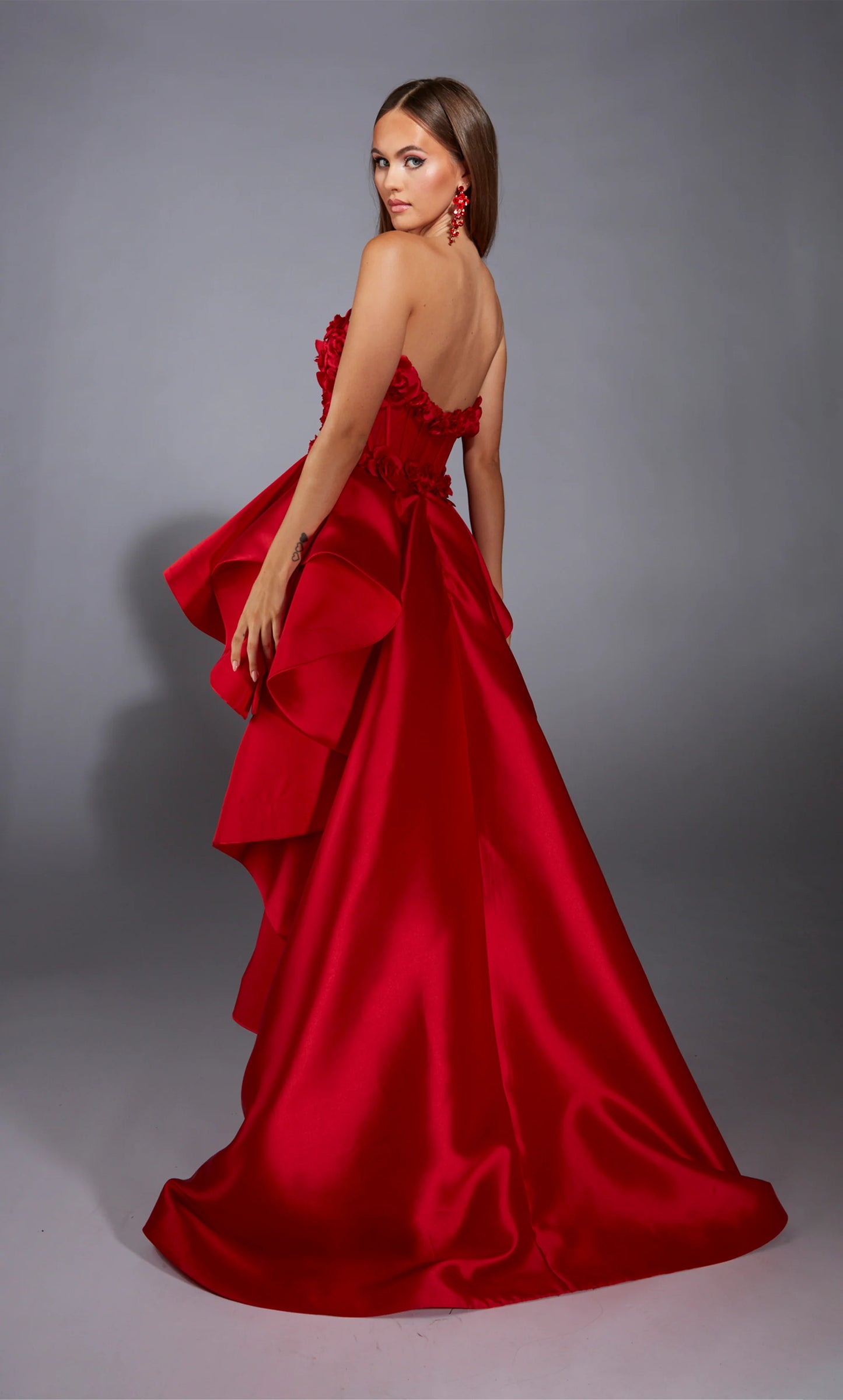Alyce Paris 61829 high-low strapless gown featuring a 3D floral corset and cascading ruffle layers.