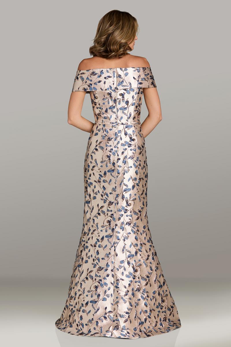 Model wearing Gia Franco 12500 off-the-shoulder brocade evening gown with fitted silhouette and floral pattern.