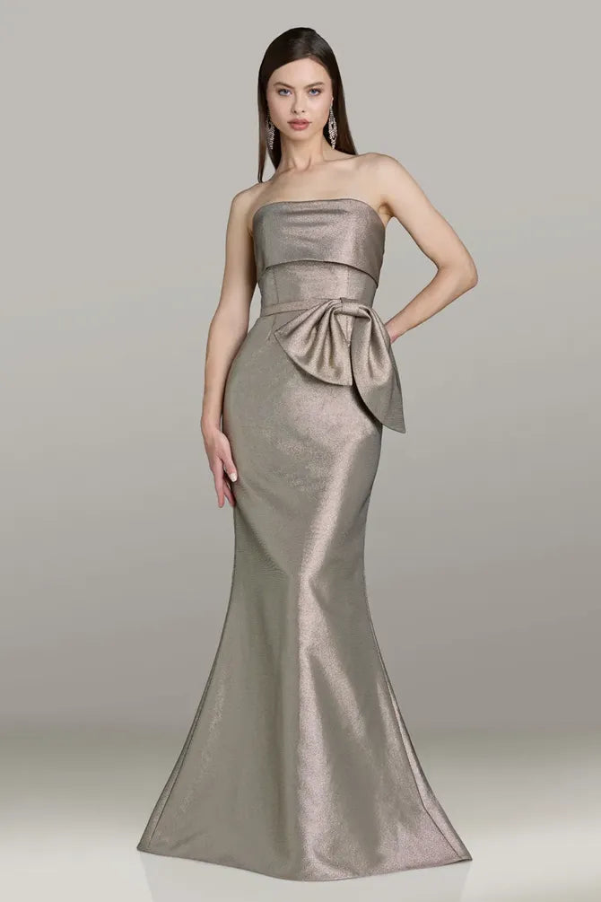 Model wearing Gia Franco 12562 strapless mermaid gown with side bow detail and fitted silhouette.