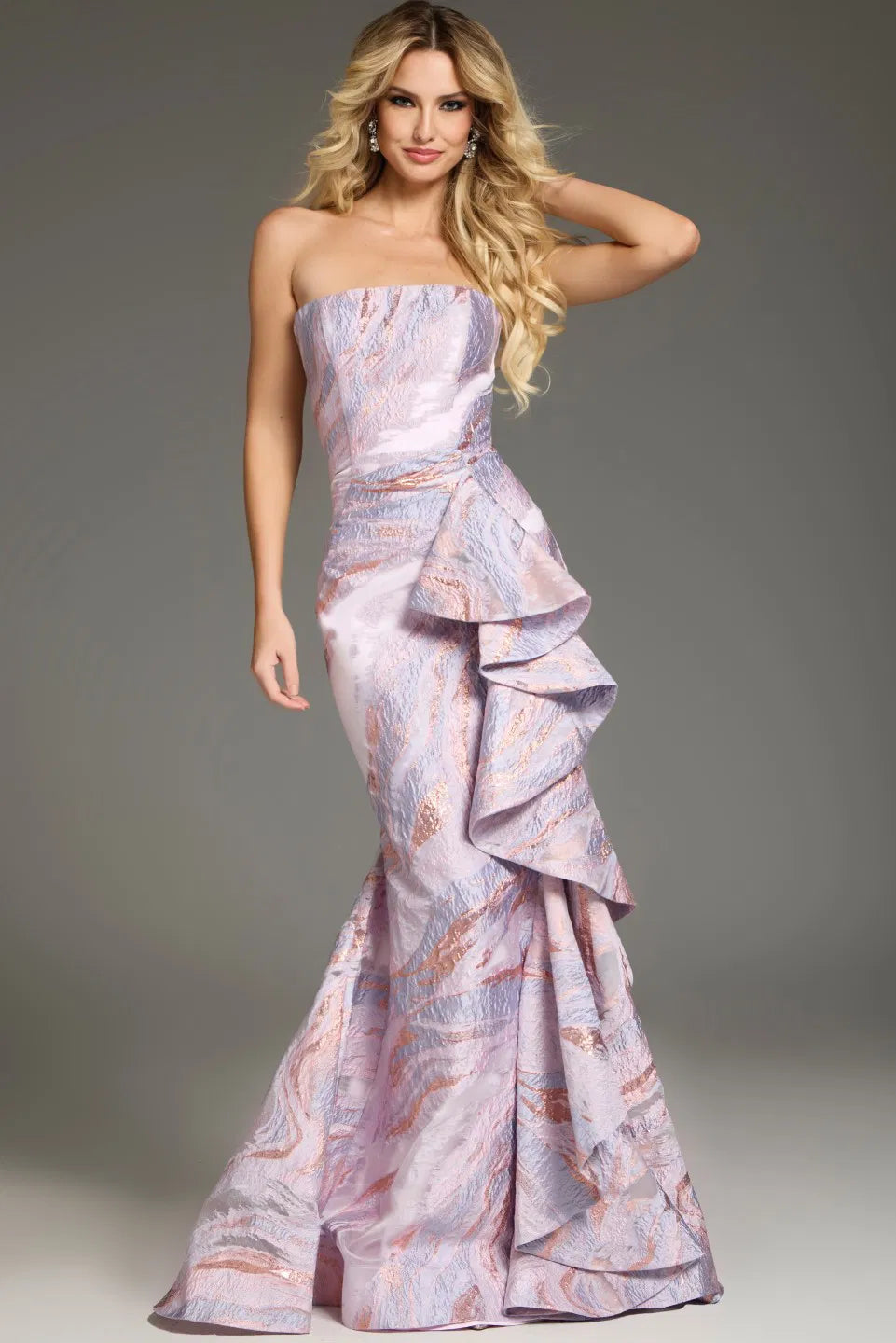 Model wearing Jovani 31137 strapless gown with cascading side ruffle, styled for an evening formal look.