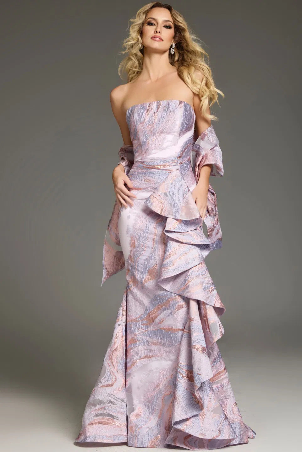Model wearing Jovani 31137 strapless gown with cascading side ruffle, styled for an evening formal look.