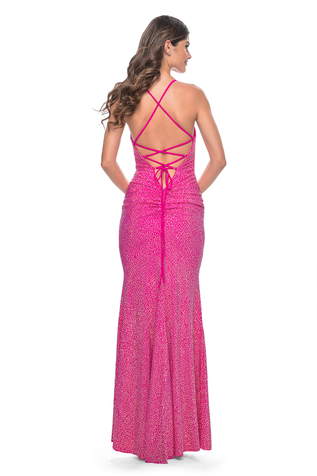 La Femme 31968 Rhinestone Embellished Prom Gown - A stunning prom gown with fully rhinestone-embellished jersey fabric, a draped neckline, lace-up tie back, and ruching along the zipper for a dazzling and elegant look.