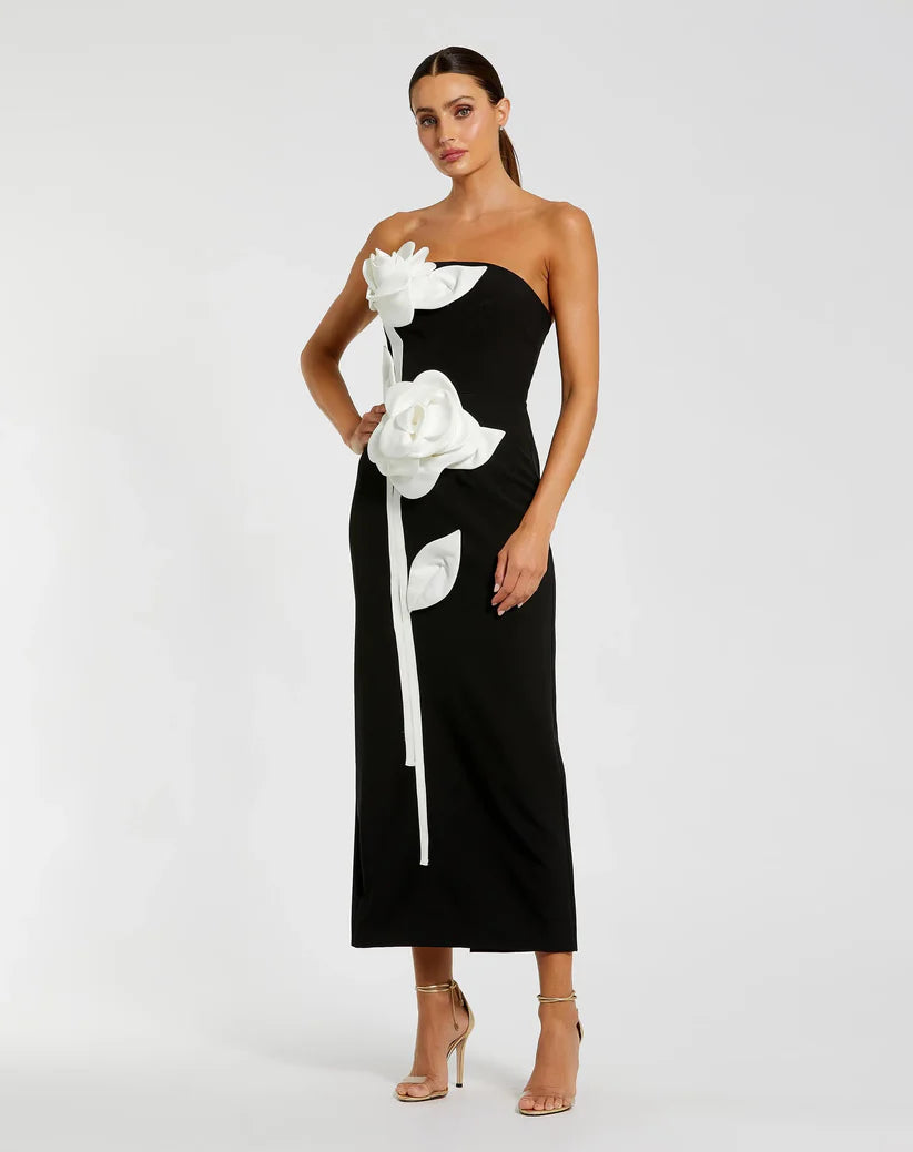 Model wearing Mac Duggal 2283 strapless crepe gown with 3D satin floral appliqués and back slit. Front View of the dress.