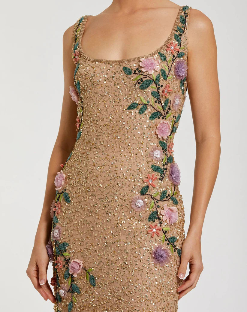 Gold sequin dress with floral embroidery on a plain background