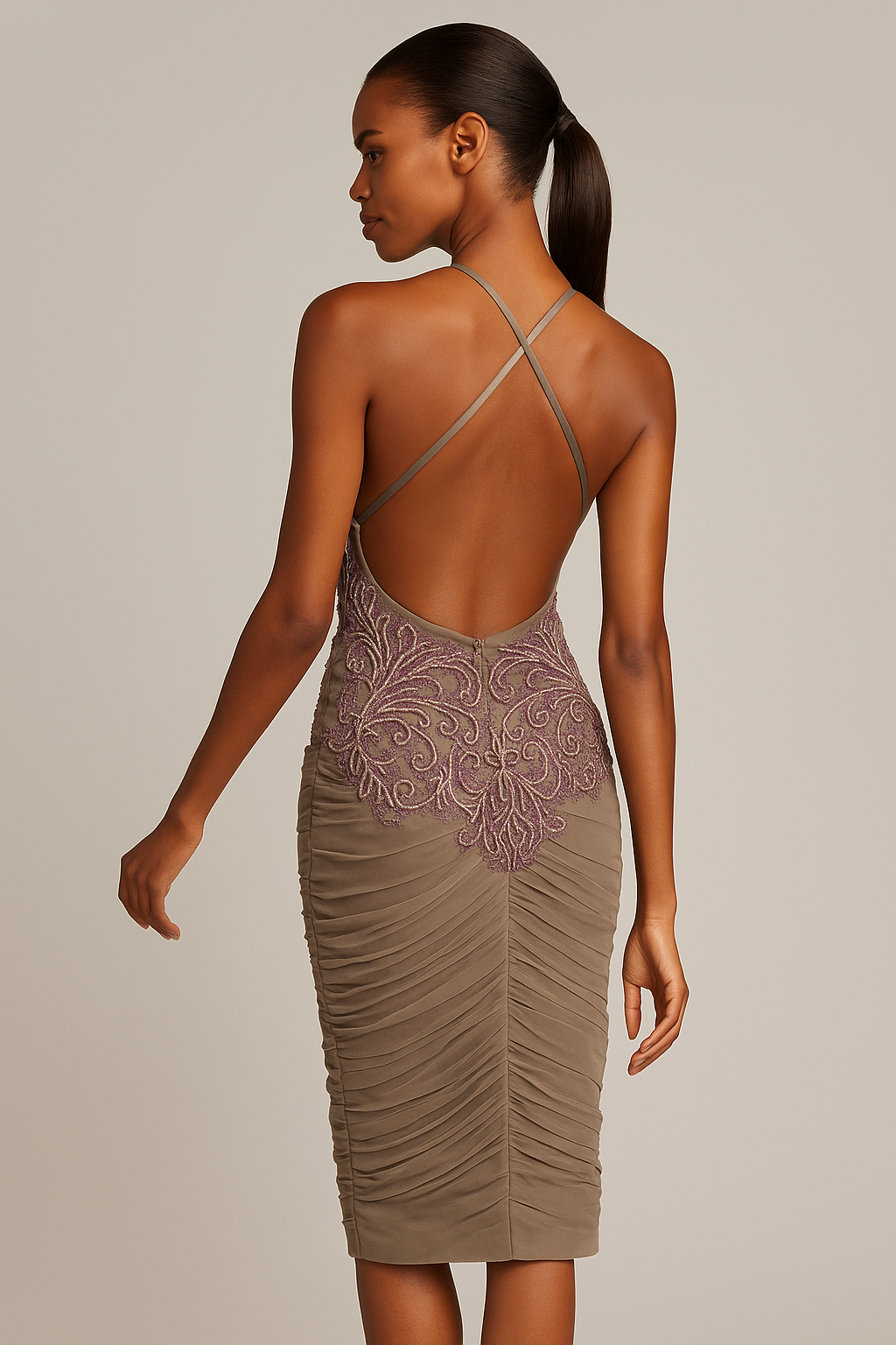 Model wearing Mandalay U01815DEB embellished cocktail dress with plunging neckline, ruched skirt, and open crisscross back.
