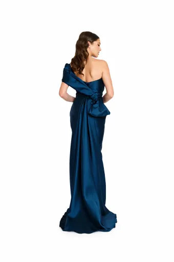 Nicole Bakti 7339 One-Shoulder Asymmetrical evening Dress - An elegant dress featuring an asymmetrical draped design, one-shoulder neckline, bow back detail, and floor-sweeping tail/train for sophistication and style. Back view of the dress.