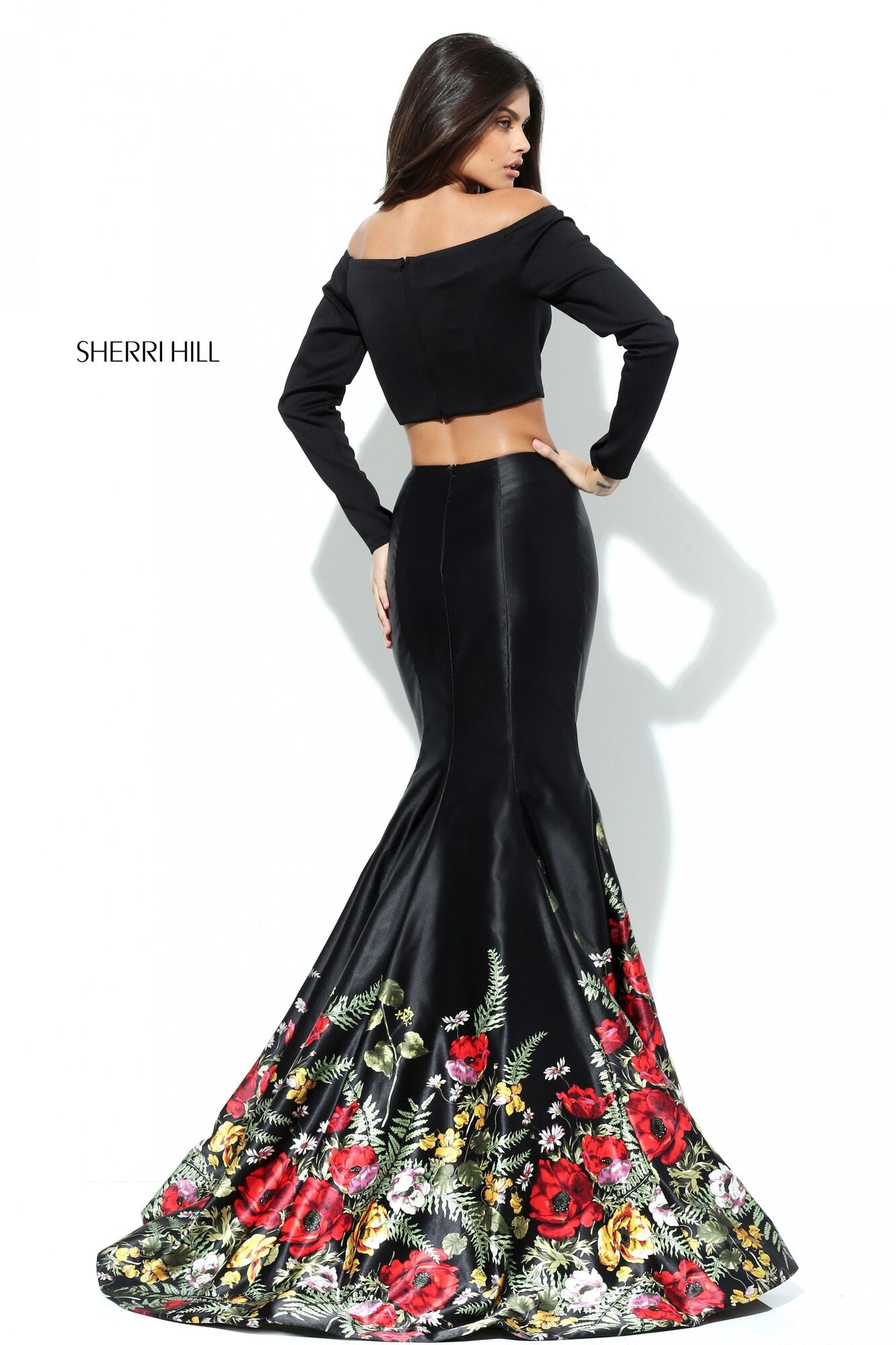 Sherri Hill 50770 Long Sleeve Two-Piece Satin Mermaid Dress featuring an off-the-shoulder crop top and a floral border on the mermaid skirt.