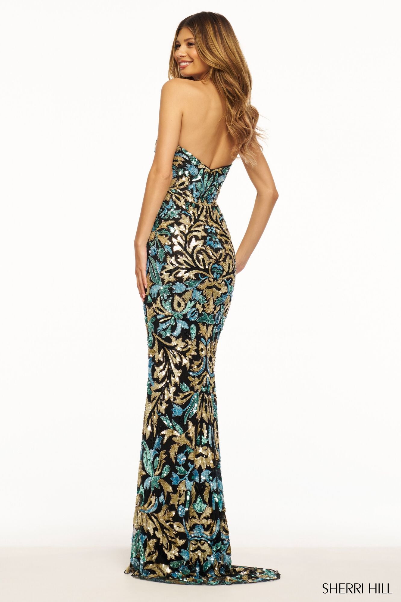 SHERRI HILL 56080 - A stunning strapless beaded gown with a sweetheart neckline, perfect for a glamorous and romantic look at prom or evening events. Back view of the model wearing the dress.