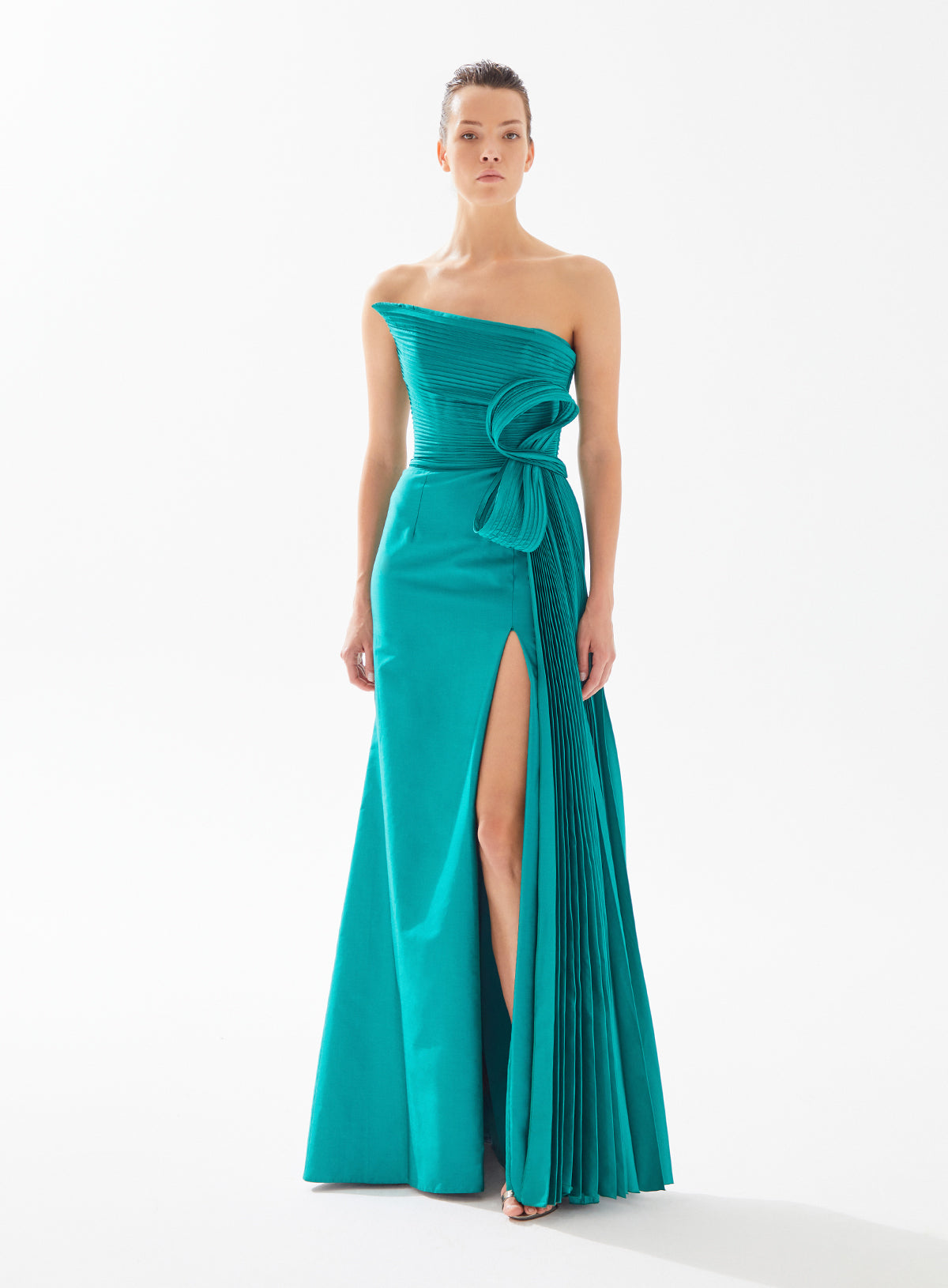 Stunning strapless draped dress with side pleat and bow by Tarik Ediz, available at Madeline's Boutique in Toronto and Boca Raton
