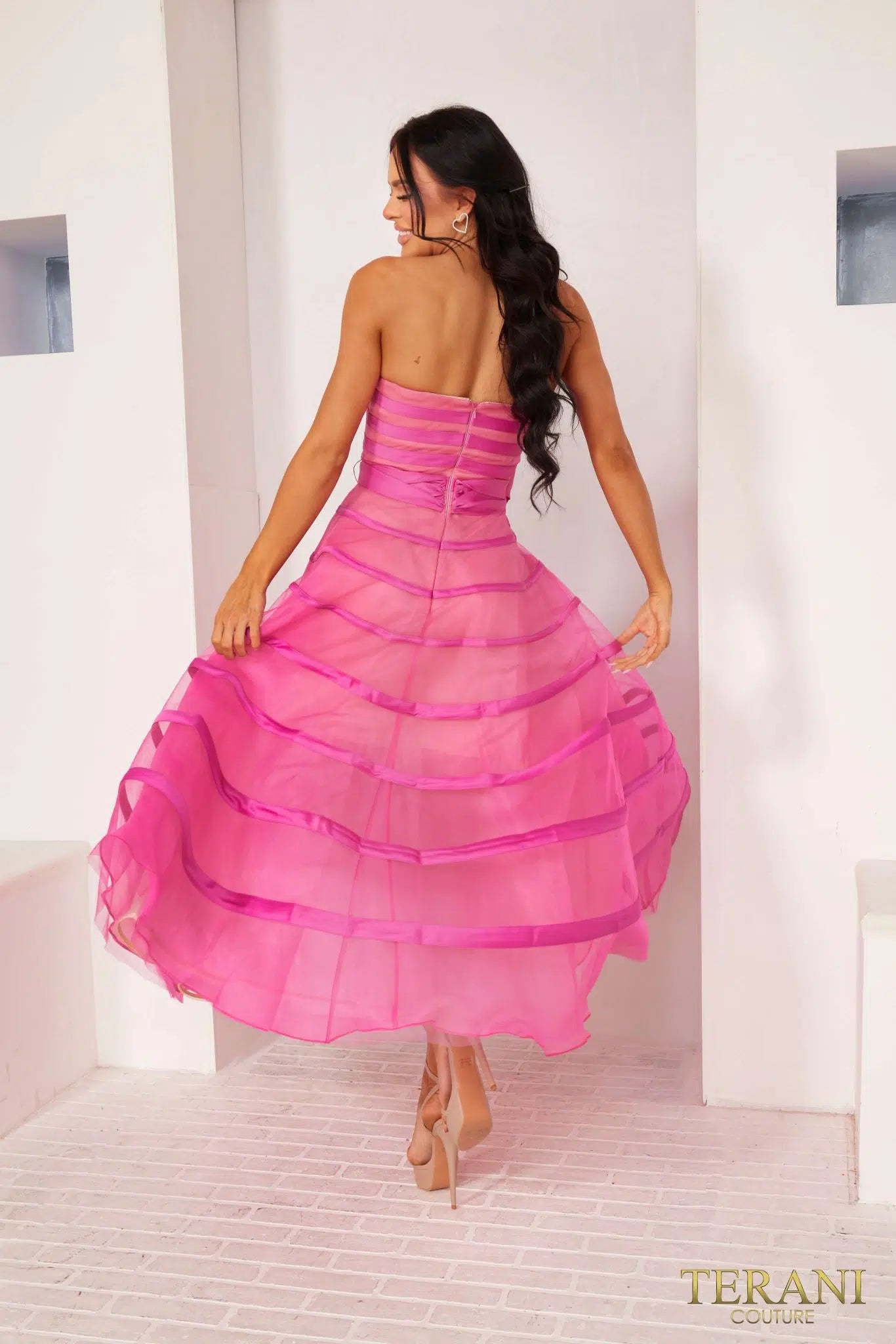 Terani 241P2044 A-line tea-length dress in fuchsia organza with bow detail, perfect for prom or formal evenings. Back View.