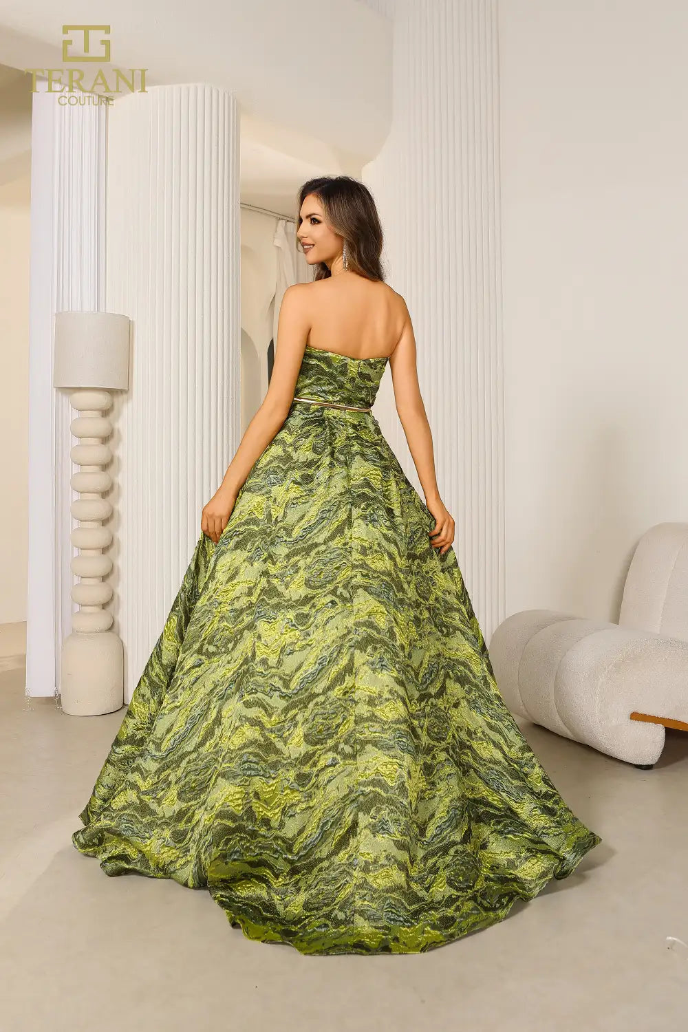 Terani 251E4269 Jacquard Ballgown featuring a strapless design, high slit, and flowing silhouette, perfect for formal evenings and mothers of the bride or groom. Model is wearing the color green.