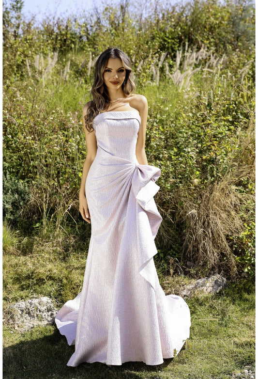 Model wearing Terani 252E5200 strapless metallic jacquard fit and flare gown with side draping detail.