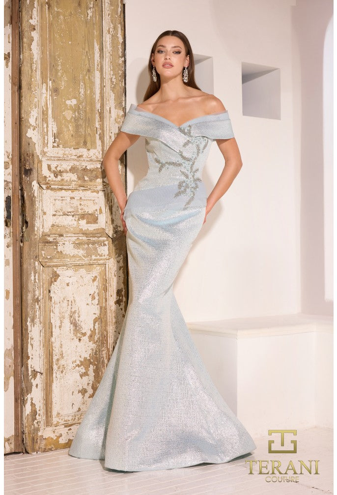 Model wearing Terani Couture 241M2771 off-the-shoulder beaded trumpet gown with fitted bodice and elegant flared skirt in the color light blue.