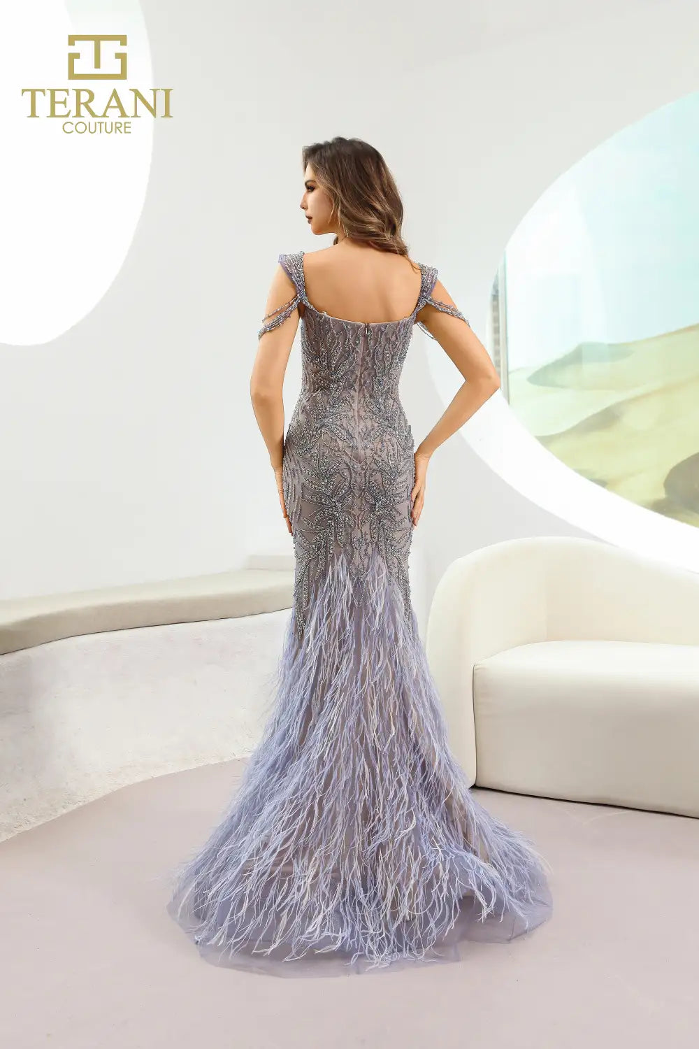 Model wearing Terani Couture 251GL4197 sweetheart trumpet gown with intricate detailing and feathered hem, perfect for formal evening, red carpet, and pageant events.