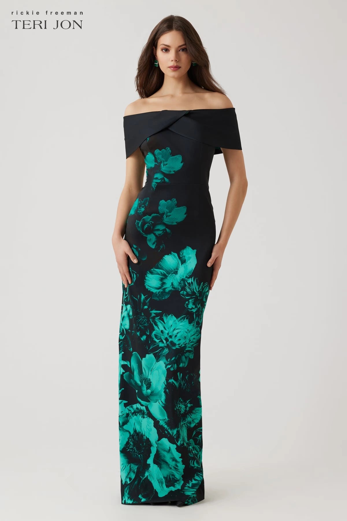 Model wearing Teri Jon 257008 off-the-shoulder column gown with bold floral print, ideal for formal evenings and mother of the bride or groom occasions.