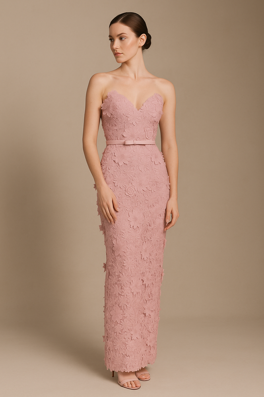 Model wearing Madeline’s Amiri strapless gown featuring 3D floral detailing, fitted silhouette, and slim belt in the color pink/pink.