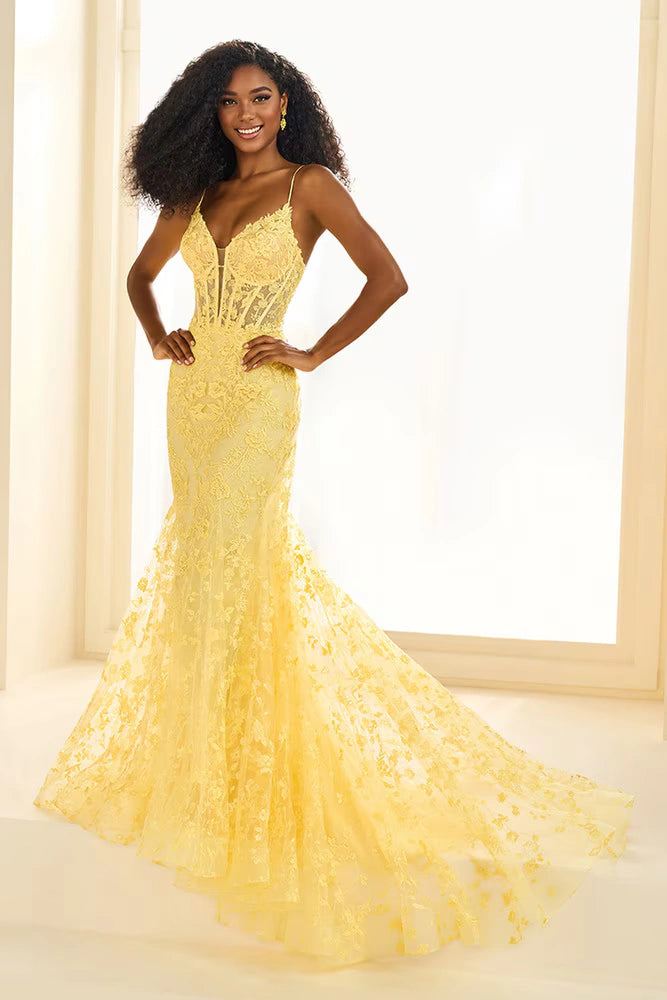 Ellie Wilde EW36008 Corset Bodice Gown in light yellow with lace-up back and glitter tulle details. Perfect for prom.  Model is wearing the dress in the color light yellow.