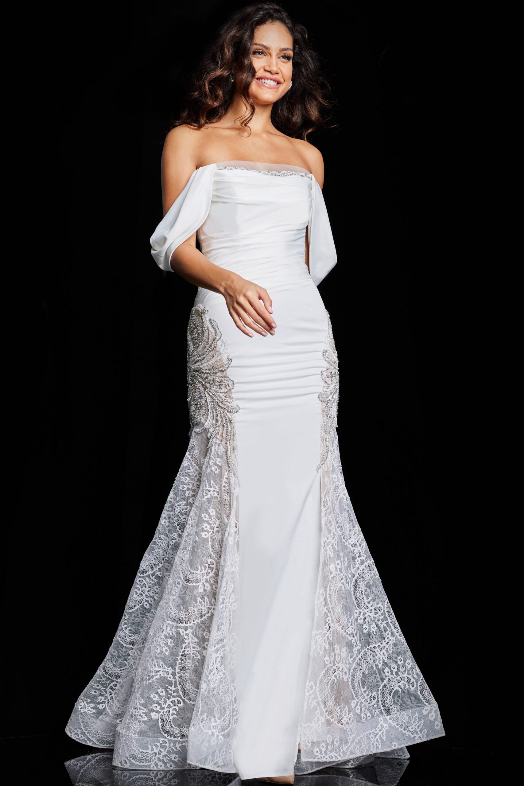 Jovani 38501 Off-Shoulder Evening Gown with Lace Appliqué - Ivory gown featuring draped sleeves, lace embellishments, and a floor-length train.