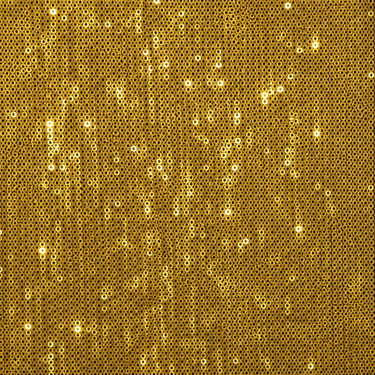 A close-up of gold sequin fabric, showing a dense pattern of small reflective gold discs with bright highlights.