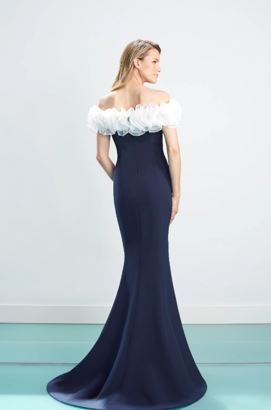 Alexander by Daymor 1461 Navy White Off-Shoulder Evening Gown - A stunning gown with an off-shoulder neckline, white ruffles, fitted bodice, and floor-length skirt with a subtle train.
