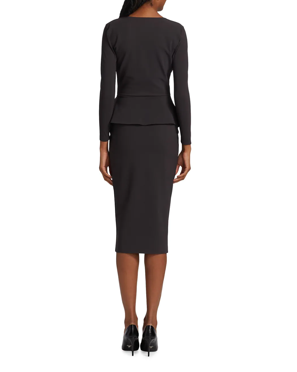 Black dress with peplum top and pencil skirt on a white background