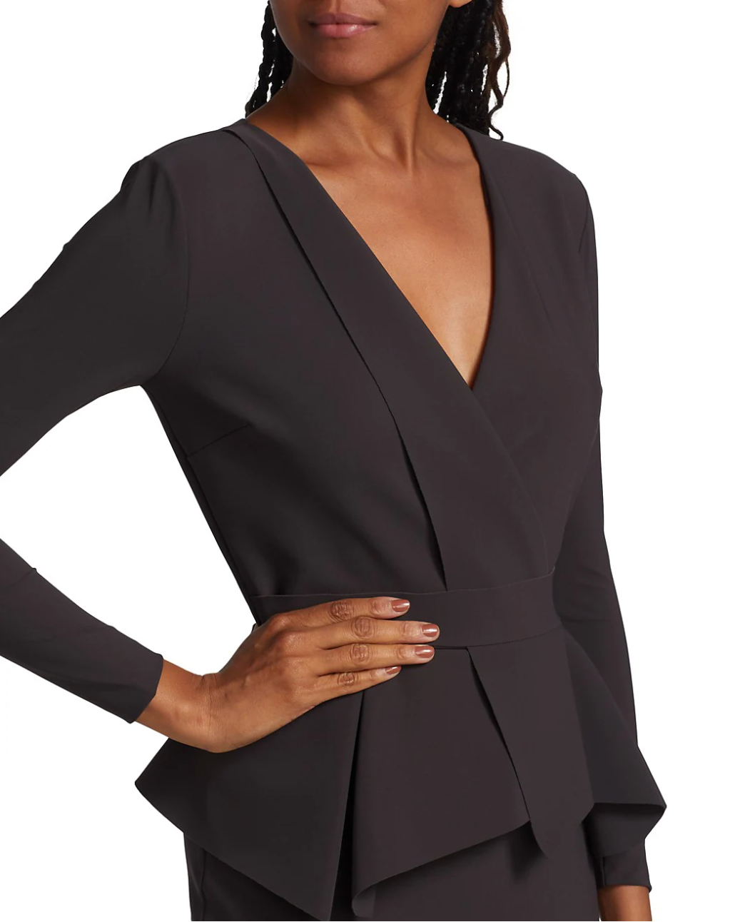 Black wrap-style top worn by a model on a white background
