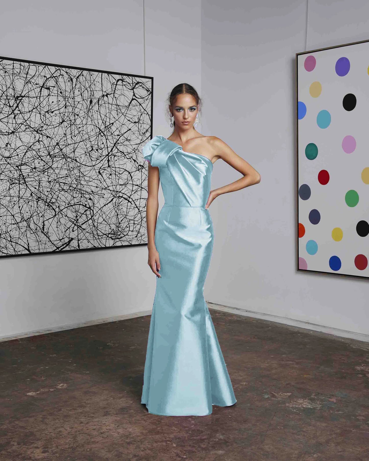 Frascara 4612 - A chic one-shoulder evening gown with an asymmetrical bow detail, perfect for formal evenings and mother of the bride or groom occasions. The model is wearing the dress in aqua.