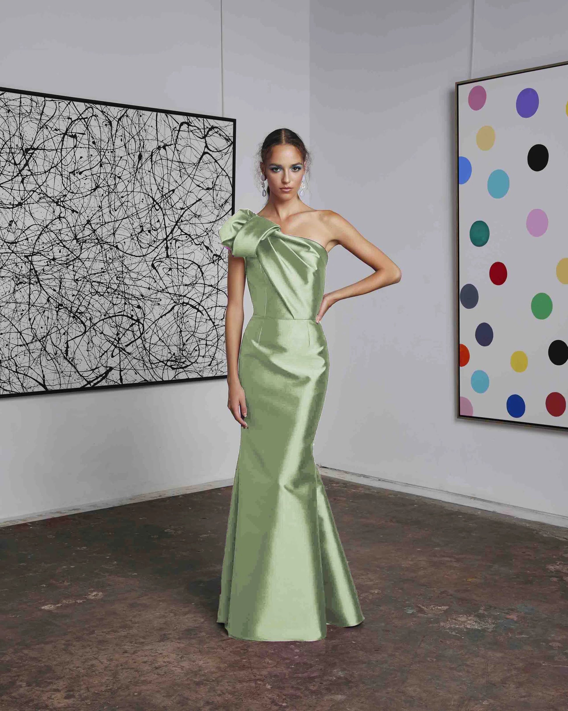 Frascara 4612 - A chic one-shoulder evening gown with an asymmetrical bow detail, perfect for formal evenings and mother of the bride or groom occasions. The model is wearing the dress in mint.