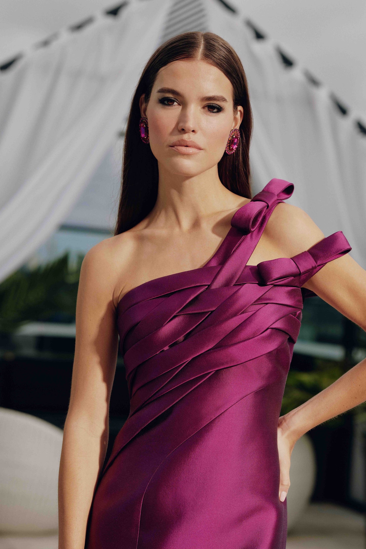 Frascara 4811 off-the-shoulder evening gown with sculpted draped bands, bow accents, and fit and flare silhouette.  Close up.