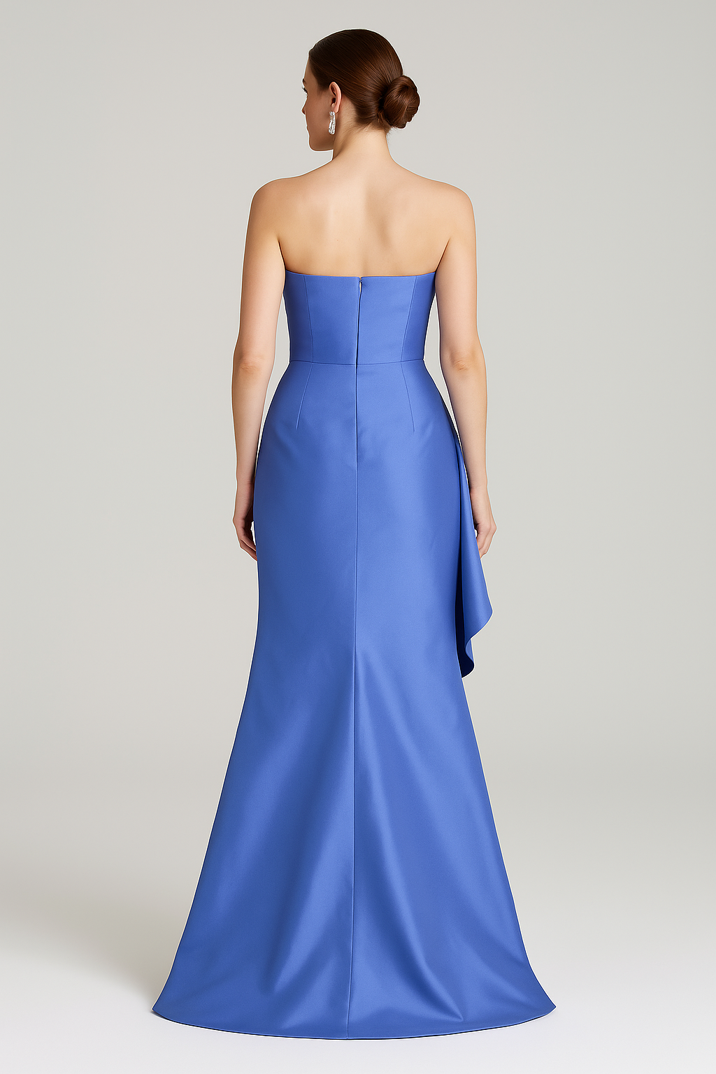 Model wearing Gia Franco 12551 strapless gown with asymmetrical draping and cascading side detail.  Back view.