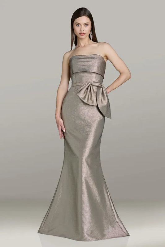 Model wearing Gia Franco 12562 strapless mermaid gown with side bow detail and fitted silhouette.