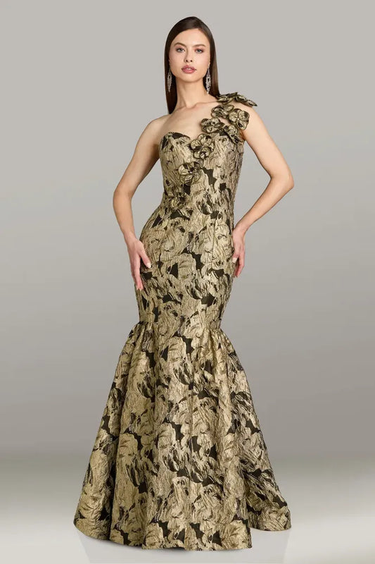 Model wearing Gia Franco 18552 one-shoulder mermaid gown with floral appliqué and flared skirt, back view showcasing elegant silhouette.