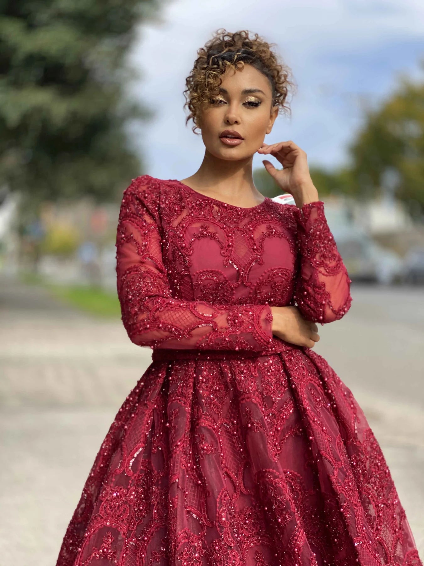 Jadore JX4048 Long Sleeve Lace Evening Gown - A stunning gown featuring long sleeves, a high neckline, intricate lace and beaded detailing, and a big flared out skirt, perfect for any evening occasion.