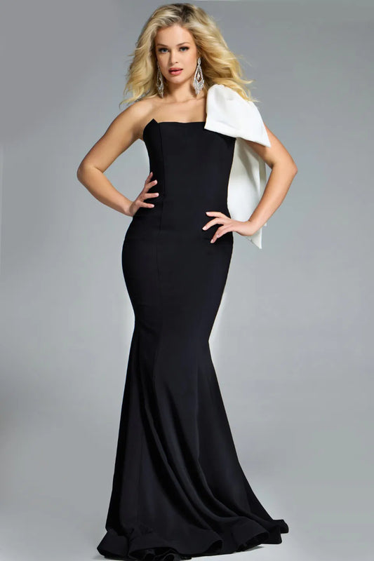 Jovani 41132 Strapless Gown featuring a sleek silhouette, strapless neckline, and a dramatic oversized white bow for formal occasions.