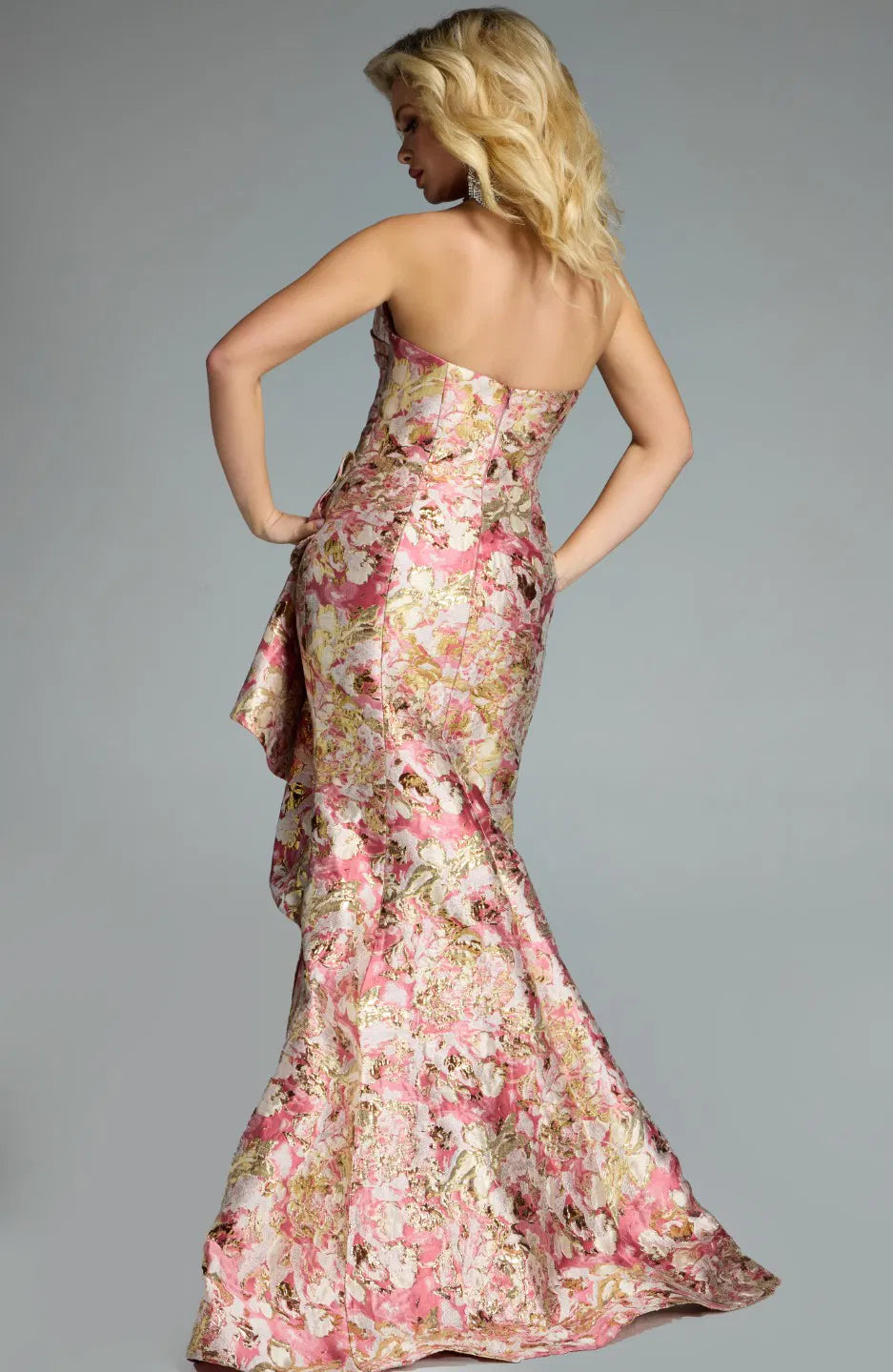 Jovani 42927 strapless jacquard mermaid gown with metallic floral patterns and a draped ruffle detail.