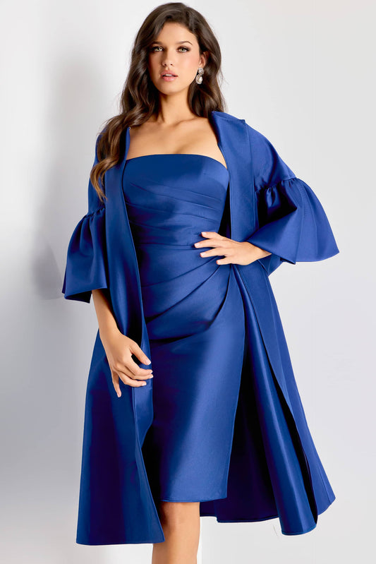 Woman wearing a blue dress with a matching jacket on a white background