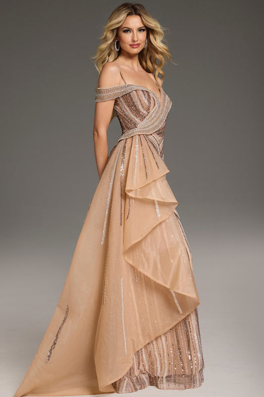 Jovani 44843 Beaded Off-Shoulder Gown featuring intricate beadwork, an off-shoulder neckline, and a layered asymmetrical overskirt.  Model is wearing the dress in the color champagne.