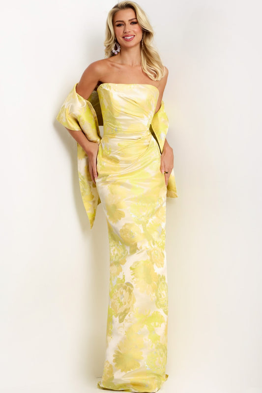 Model wearing Jovani 45289 strapless floral column gown with straight neckline, high slit, and matching drape.