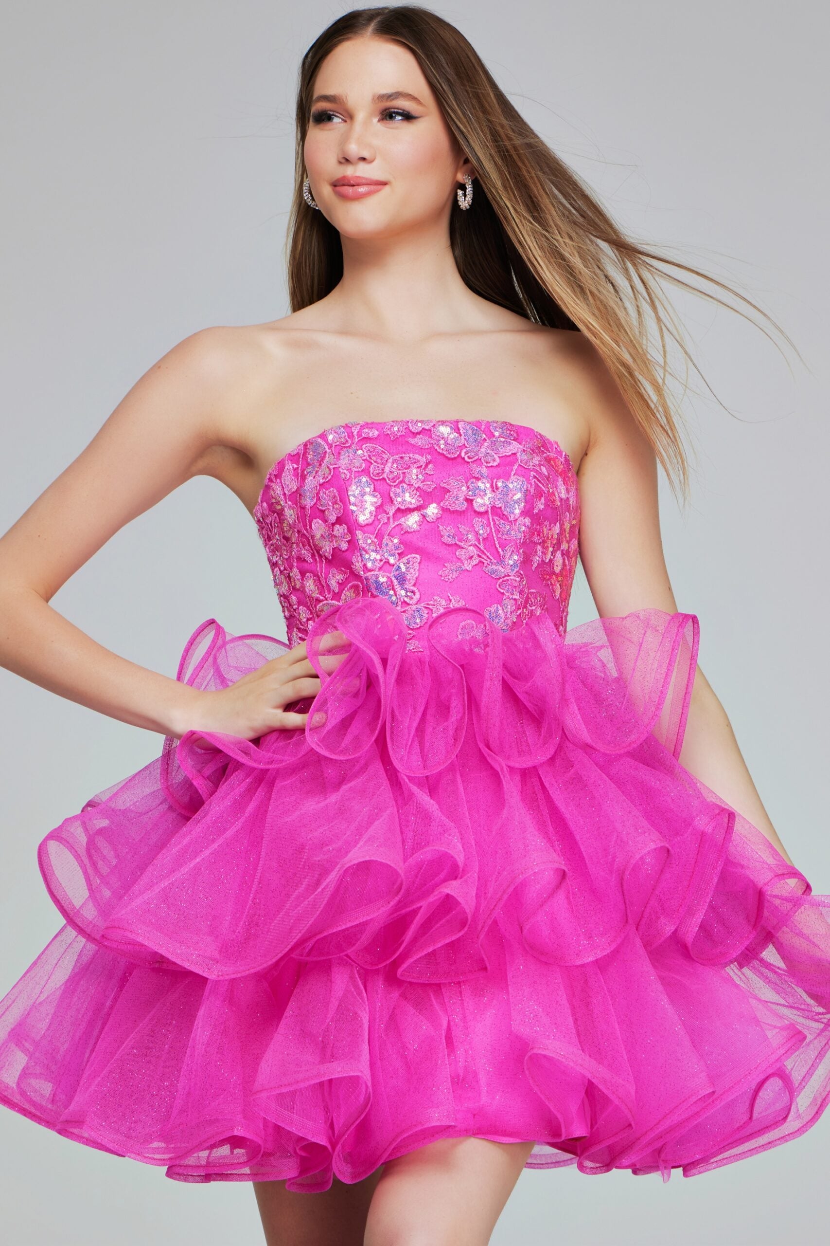 Jovani K38440 Beaded A-Line Ruffled Dress - A stunning A-line gown featuring a beaded bodice and ruffled skirt for an elegant, formal look.  Model is wearing the dress in the color hot pink.