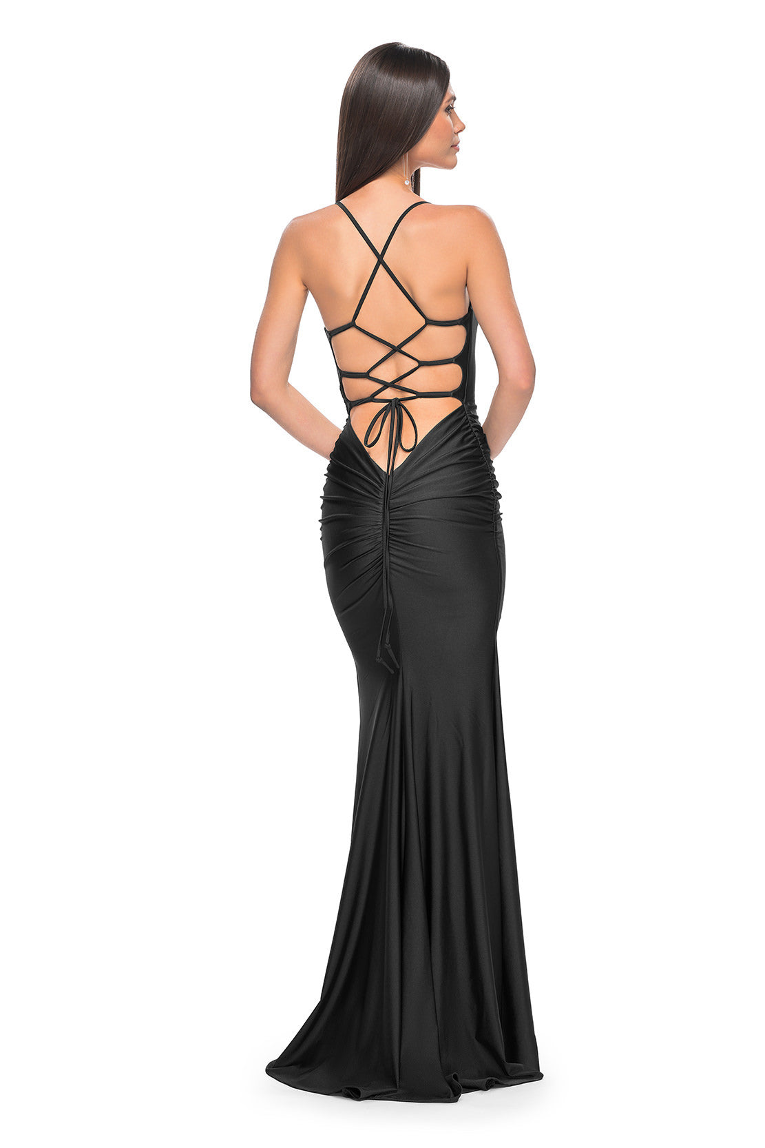 La Femme 31618 Chic Fitted Long Jersey Prom Dress - A sophisticated prom dress with a chic fitted silhouette, ruching detail, criss-cross style bodice, and an open back with a lace-up tie. Model is wearing the dress in the color black.